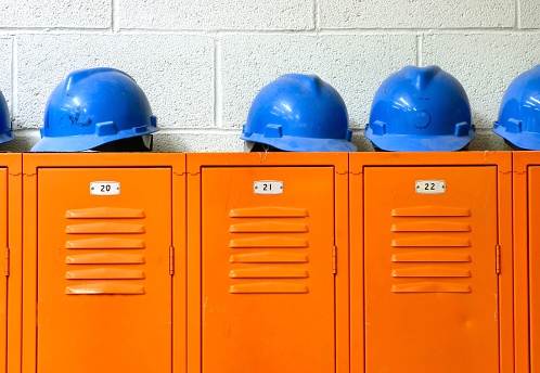 Blue Hard Hats on top of orange Lockers